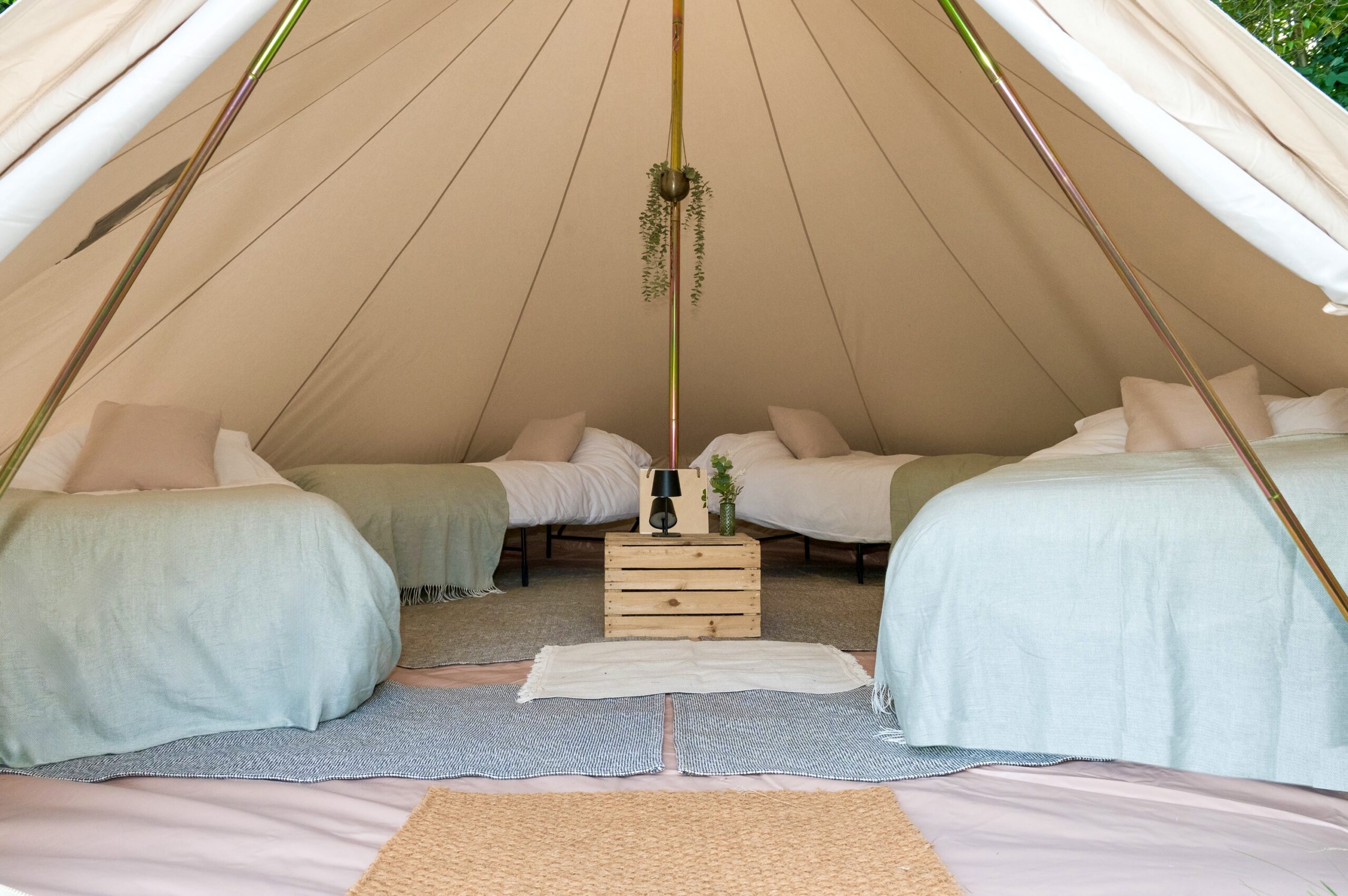 Memory foam single hire beds made up inside a bell tent